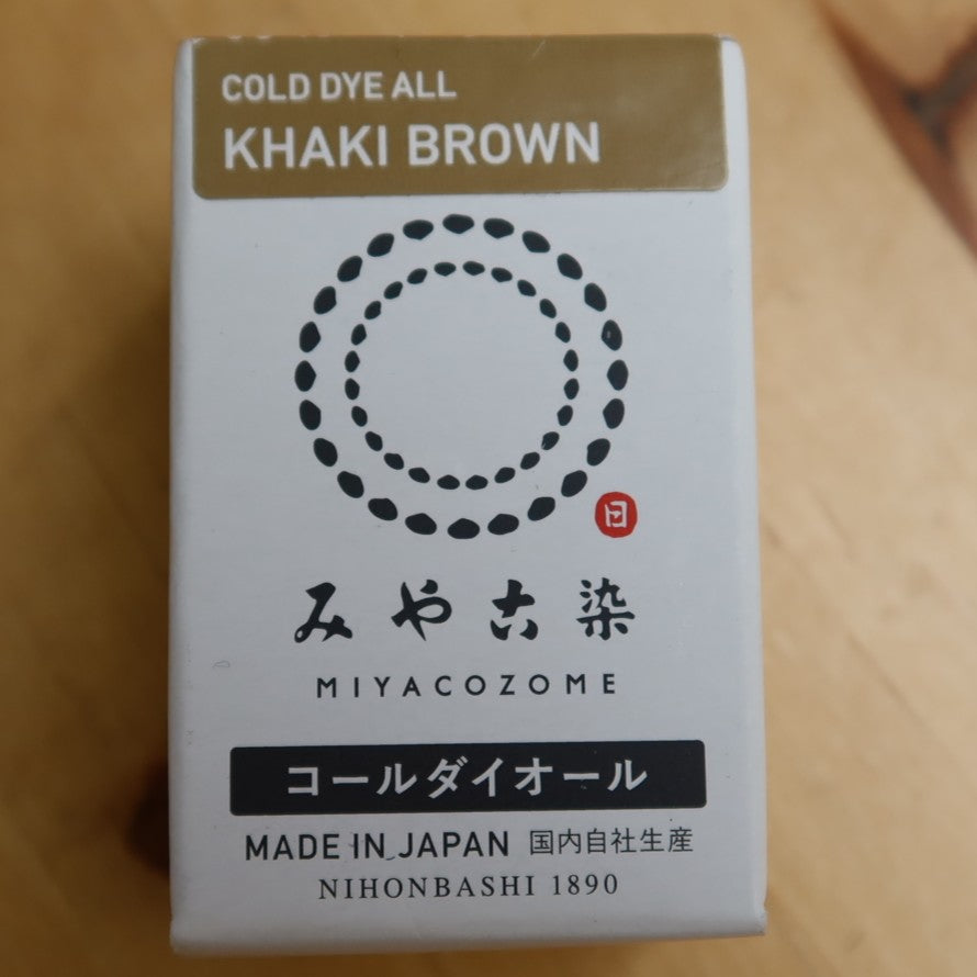 Box of Cold Dye All Khaki Brown by Miyacozome on a wooden surface